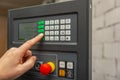 The process of programming a CNC machine. Entering data into a computer controlled machine. CNC machine operator enters data Royalty Free Stock Photo