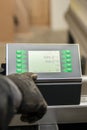 The process of programming a CNC machine. Entering data into a computer controlled machine. CNC machine operator enters Royalty Free Stock Photo