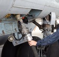 The process of refueling airplane in airport. Fuel hose is inserted Royalty Free Stock Photo