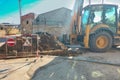 The process of repair and restoration of the operability of the underground utilities section. Excavator dug trench over Royalty Free Stock Photo