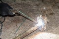 Process of repairing a metal hammer using electric electrode welding