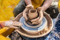 Process of rotation of potter`s wheel, hands of ceramist Royalty Free Stock Photo