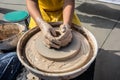 Process of rotation of potter`s wheel, hands of ceramist Royalty Free Stock Photo