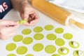 The process of sculpting dumplings. Green dumplings with cheese. Royalty Free Stock Photo
