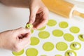 The process of sculpting dumplings. Green dumplings with cheese. Royalty Free Stock Photo