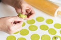 The process of sculpting dumplings. Green dumplings with cheese.