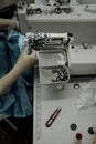 The process of sewing buttons for a dress by a craftsman Royalty Free Stock Photo