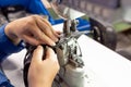 The process of sewing shoes on a sewing machine. Shoe production Royalty Free Stock Photo