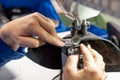 The process of sewing shoes on a sewing machine. Shoe production Royalty Free Stock Photo