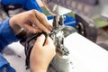 The process of sewing shoes on a sewing machine. Shoe production Royalty Free Stock Photo