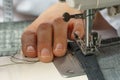 Process of shortening jeans pants on a sewing machine