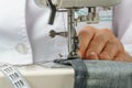 Process of shortening jeans pants on a sewing machine