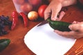 The process of slicing and preparing a salad of fresh homemade vegetables