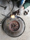 Process of soldering a large automobile flywheel with autogenous Royalty Free Stock Photo