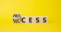 Process and Success symbol. Turned cube with words success and process. Beautiful yellow background. Businessman hand. Business