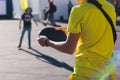 Process of throwing frisbee, kids teenagers tossing disc golf outdoors in a city park in a summer sunny day, frisbee playing with Royalty Free Stock Photo