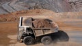 Process of transporting mine waste material with CAEX to waste dumps Royalty Free Stock Photo