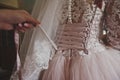 The process of tying wedding bridesmaid dresses 532. Royalty Free Stock Photo