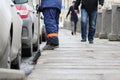 Process of urban street cleaning sweeping. Worker with broom and dust pan Royalty Free Stock Photo