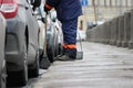 Process of urban street cleaning sweeping. Worker with broom and dust pan Royalty Free Stock Photo