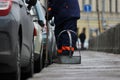 Process of urban street cleaning sweeping. Worker with broom and dust pan Royalty Free Stock Photo