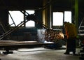 The process of welding metal construction in the workshop of the plant for the production of large trucks