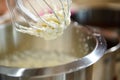 The process of whipping cream to firm peaks or egg whites in planetary mixer. Whipped cream for cakes and sweet desserts