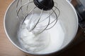 The process of whipping egg whites in a planetary mixer. Selective focus Royalty Free Stock Photo