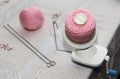 Process of winding pink wool yarn from tangle to winding, using a coiler Royalty Free Stock Photo