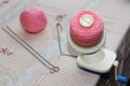 Process of winding pink wool yarn from tangle to winding, using a coiler Royalty Free Stock Photo