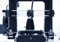 The process of working 3D printer and creating a three-dimensional object Royalty Free Stock Photo