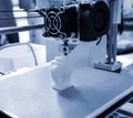 The process of working 3D printer and creating a three-dimensional object Royalty Free Stock Photo