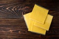 Processed cheese on dark wooden background Royalty Free Stock Photo