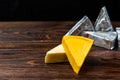 Processed cheese on dark wooden background Royalty Free Stock Photo