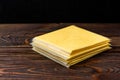 Processed cheese on dark wooden background Royalty Free Stock Photo