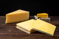 Processed cheese on dark wooden background Royalty Free Stock Photo