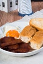 processed meat with egg and pandesal Filipino bread for breakfast