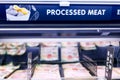 Processed Meat signage at the meat section of supermarket with defocused background