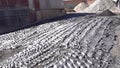 processed silver ore spread on the ground to dry in the sun