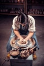 Master class on modeling of clay on a potter& x27;s wheel In the pottery workshop. Royalty Free Stock Photo