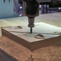 Processing of panels on the coordinate-milling woodworking machine with CNC Royalty Free Stock Photo