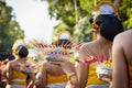 Procession of beautiful Balinese women in traditional costumes