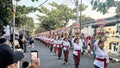 Procession of beautiful Balinese women in traditional costumes - sarong, carry offering on heads for Hindu ceremony. culture of Royalty Free Stock Photo