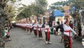 Procession of beautiful Balinese women in traditional costumes - sarong, carry offering on heads for Hindu ceremony. culture of Royalty Free Stock Photo