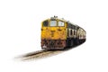 Procession yellow Train led by old diesel electric locomotive on the tracks Royalty Free Stock Photo