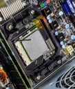 The processor of the computer the thermal paste applied on it. Details of the computer`s system unit Royalty Free Stock Photo