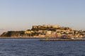 Procida island at sunset seen from the sea, Gulf of Naples, Italy Royalty Free Stock Photo