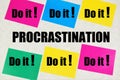 Procrastination inscription on the background of business planning signs - Do it.