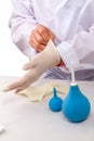 Proctologist doctor putting on rubber gloves Royalty Free Stock Photo