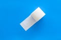 Proctology concept with toilet paper on blue background top view Royalty Free Stock Photo